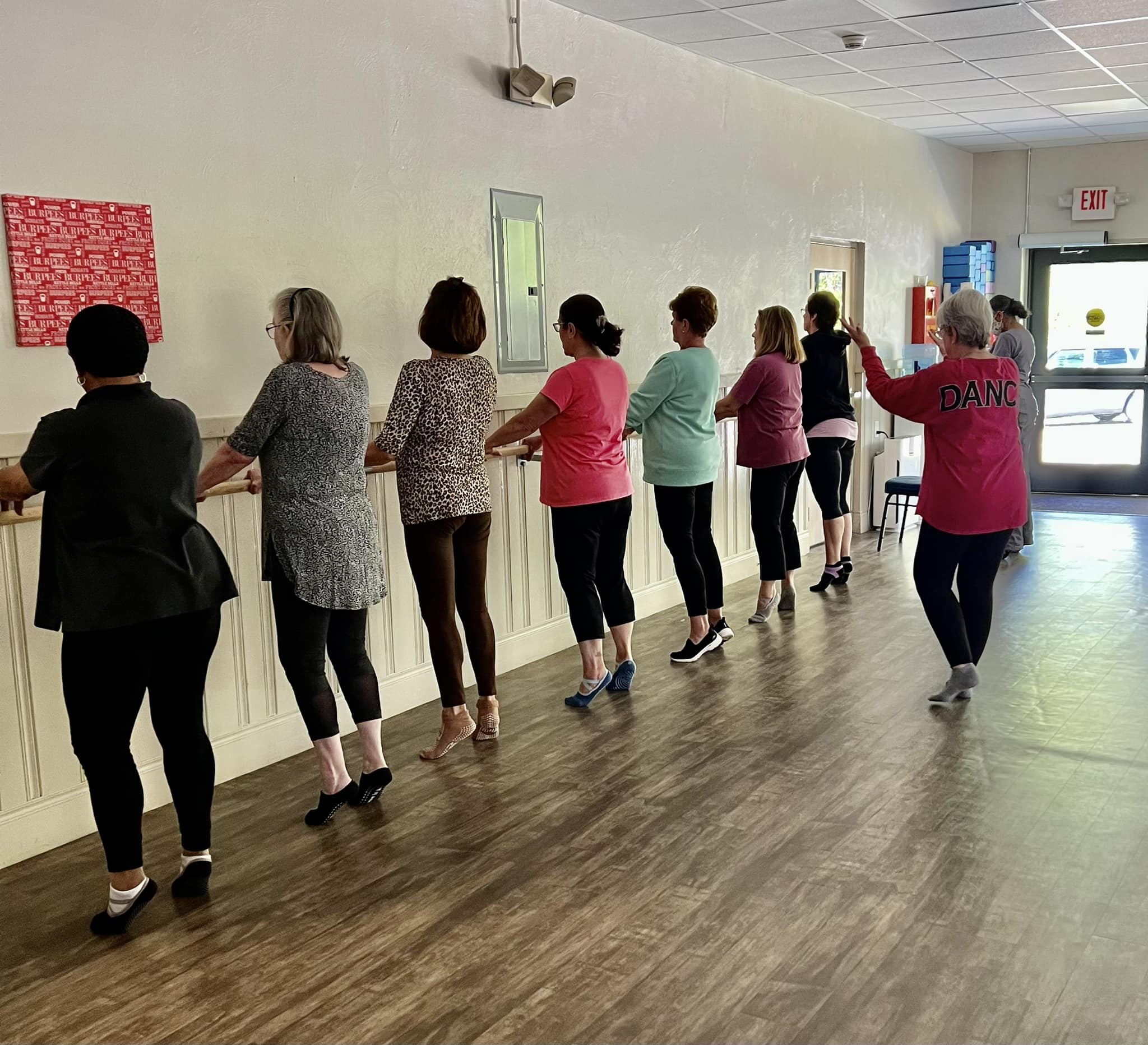 Seniors taking a barre class
